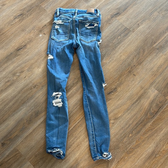 Medium wash skinny jeans with holes - Picture 2 of 4